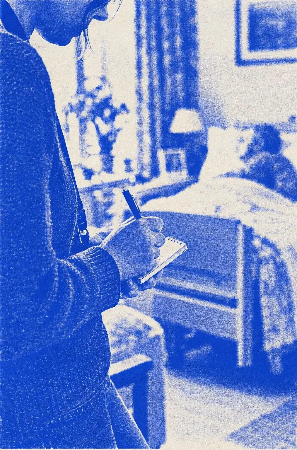 A care worker writing in a notebook